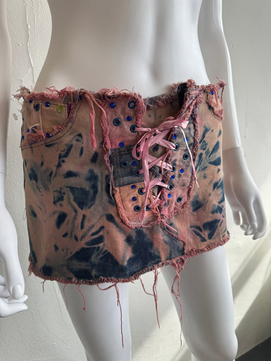 Modern punk pink bleach tie-dye mini skirt with raw edges and corset detail